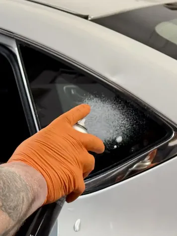 Glass cleaner applied to newly installed quarter glass