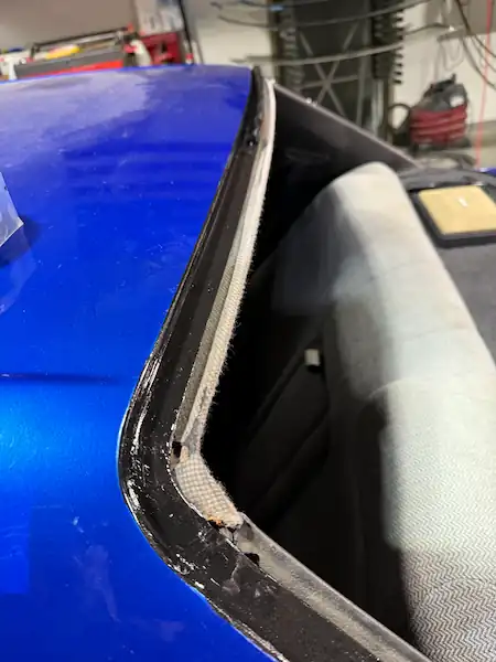 Nissan Skyline pinch weld cleaned, primed, and ready for glass installation at 123 Glass Company in Omaha