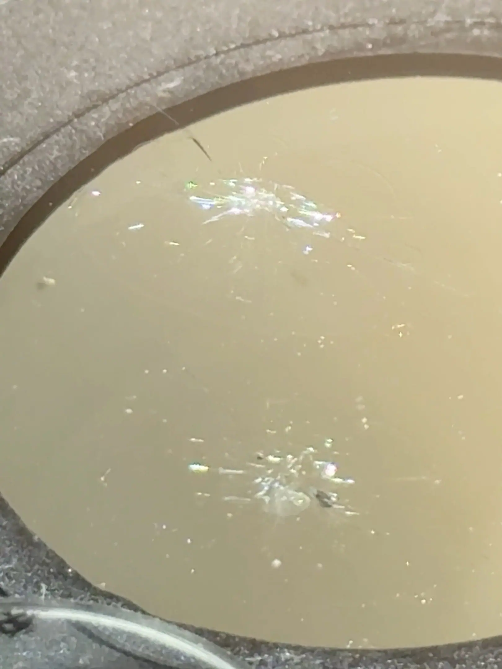 Completed windshield chip repairs with only faint blemishes remaining.