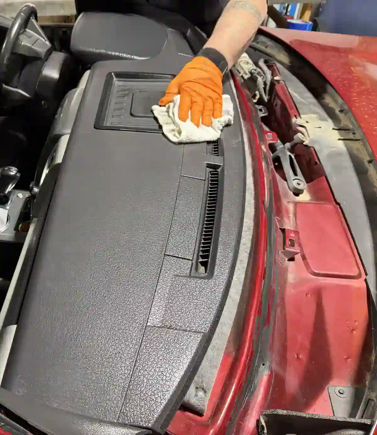 Cleaning the dashboard and interior before windshield replacement at 123 Glass Company in Omaha