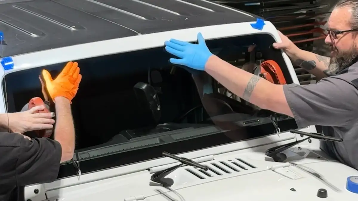 Brian decking and aligning a new windshield during replacement at 123 Glass Company in Omaha