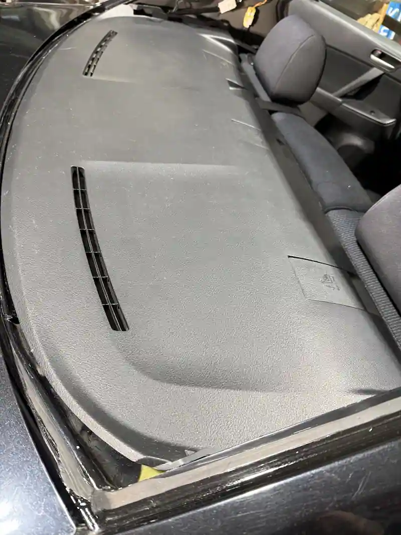 Rear opening cleaned out and prepped on a black sedan after glass removal at 123 Glass Company in Omaha