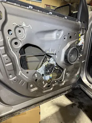 Door panel removed for window regulator replacement at 123 Glass Company in Omaha