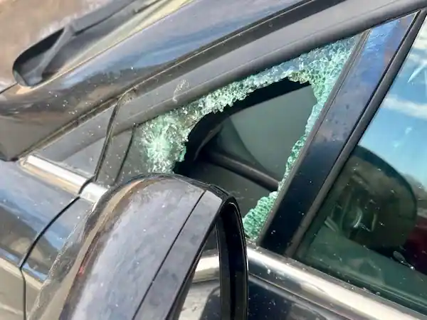 Front driver side vent window broken on a black car