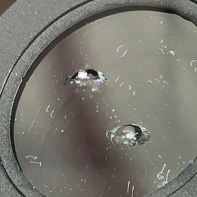 Windshield chip — small impact fully penetrating the outer layer of glass.