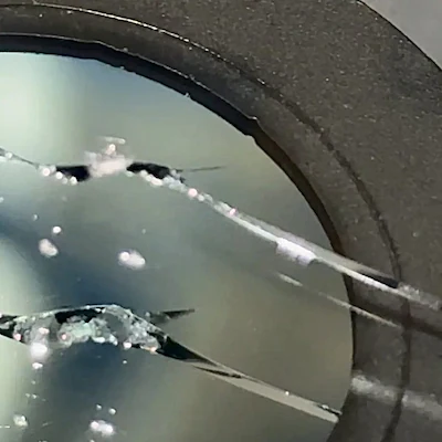 Floater crack on windshield — longer line crack away from any edge.